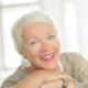 Smiling woman, online hypnotherapy for cancer
